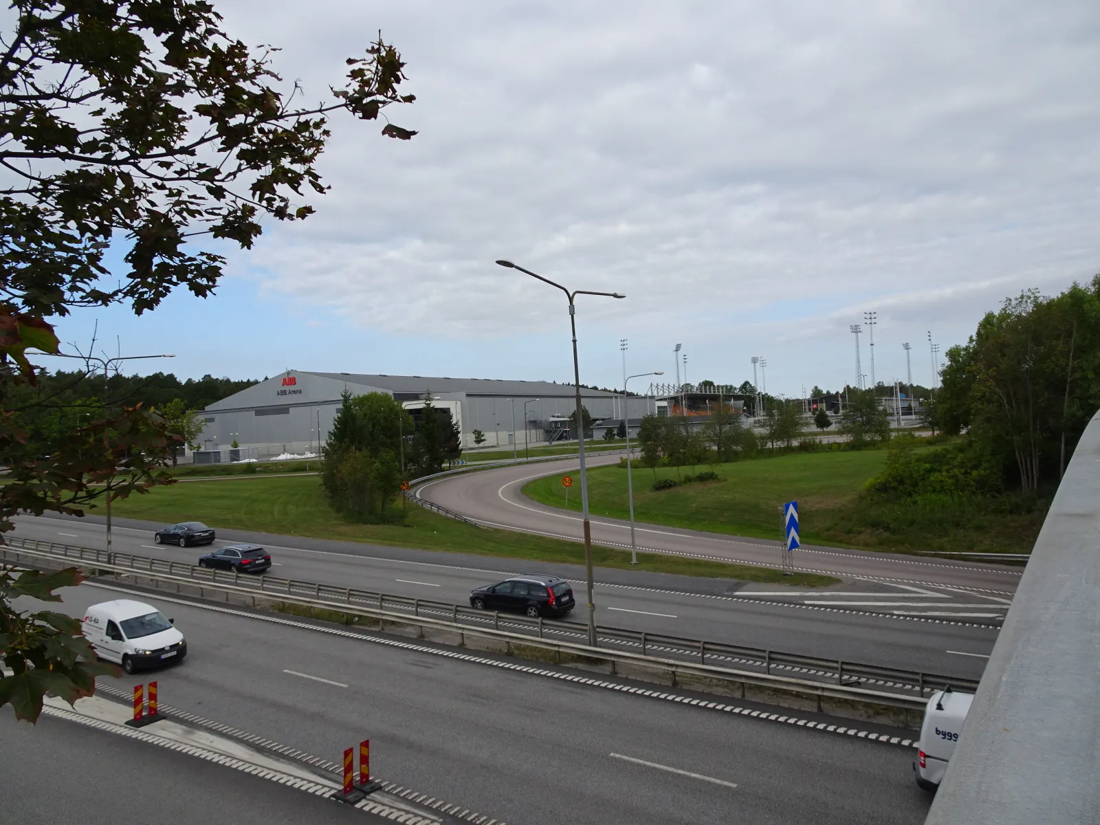 ABB Arena Syd seen from across the E18 slip road on Rocklunda — ABB Arena Syd