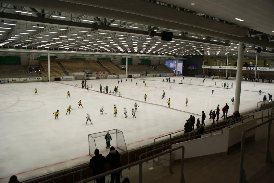 The ice sheet of ABB Arena Syd with children skating and playing — ABB Arena Syd