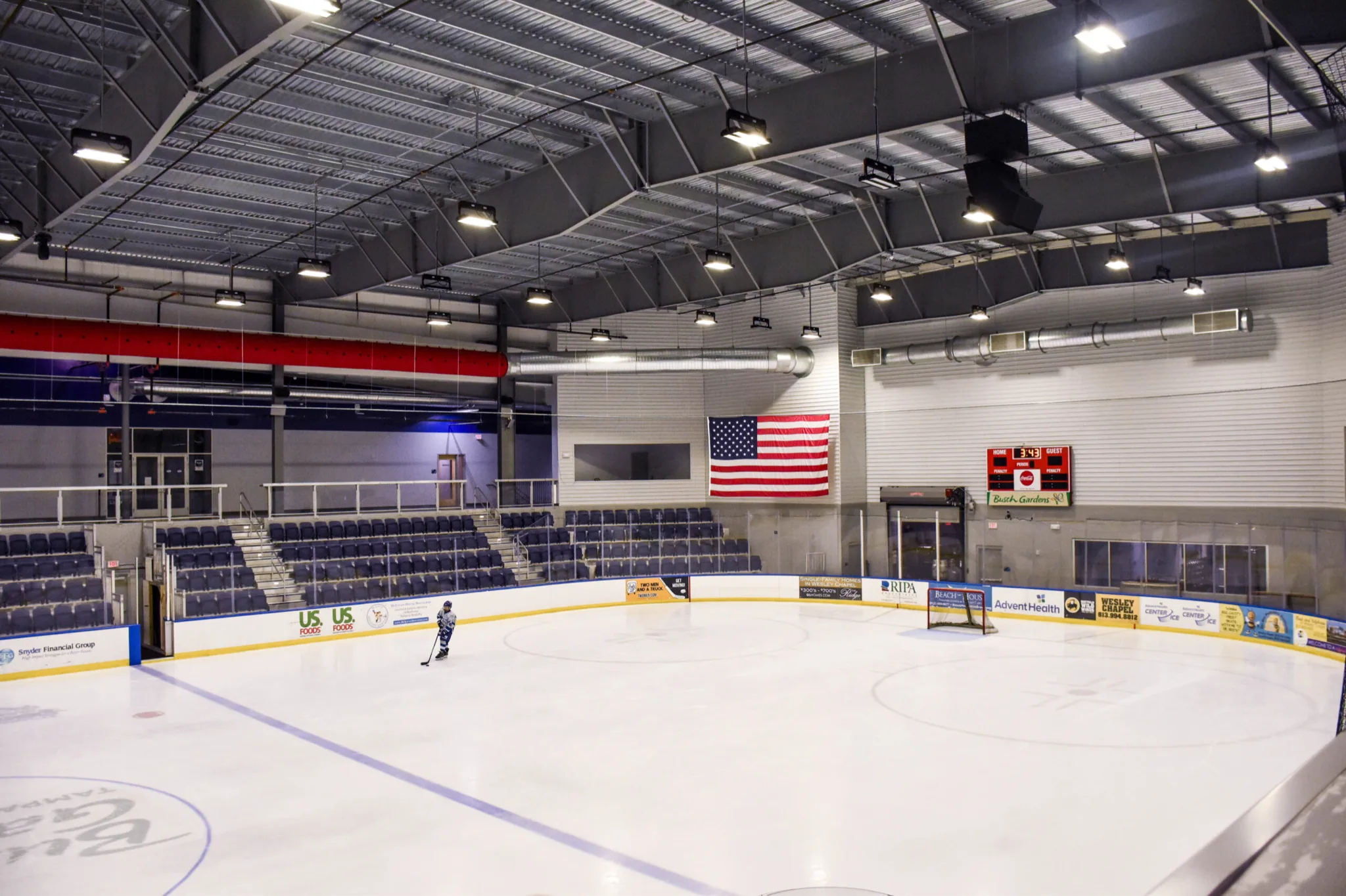 Nearly the whole ice sheet seen from just above the boards at one corner — AdventHealth Center Ice (Wesley Chapel)