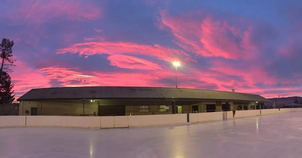 The Iceinline rink and pavilion at sunset — Alexandra Iceinline