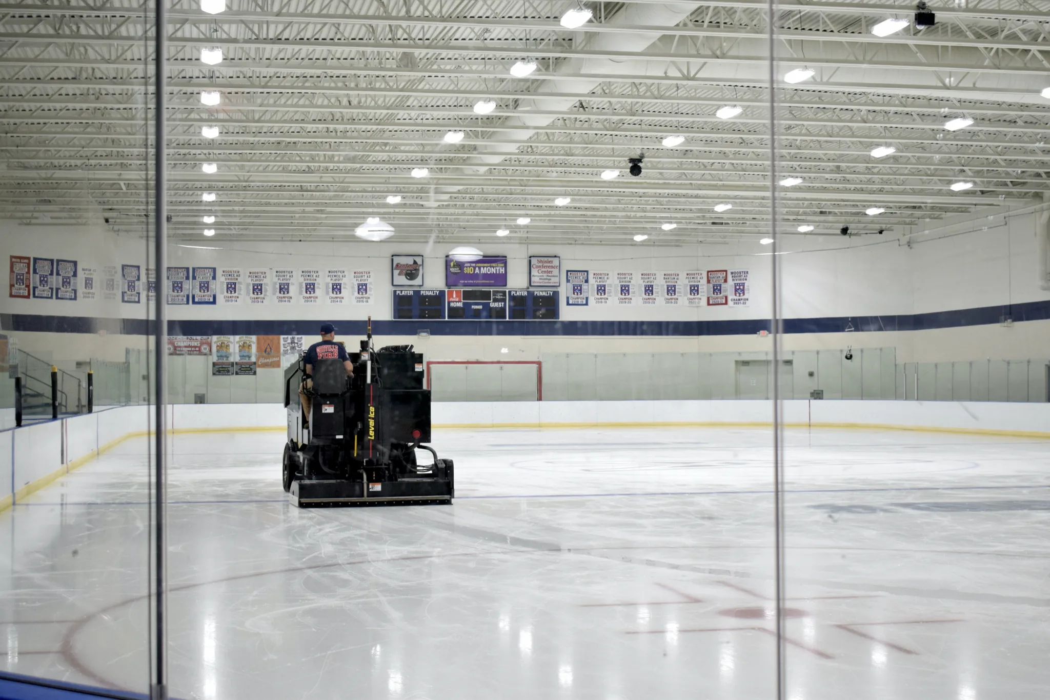 Nearly the whole ice sheet shot through the end-boards glass — Alice Noble Ice Arena (Wooster)