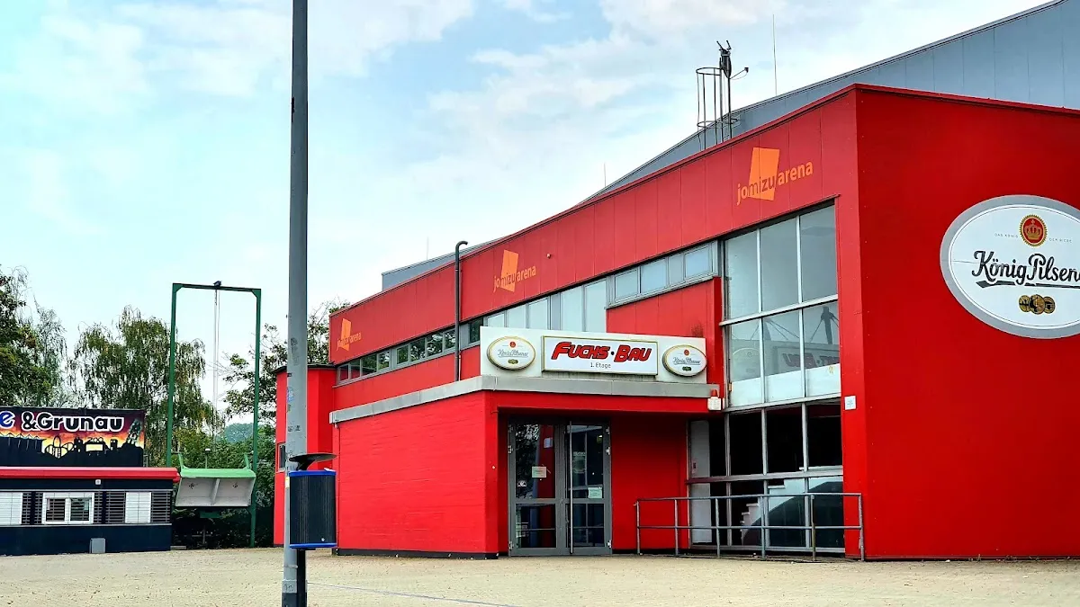 The red-painted front of the alleato Arena in Duisburg, home of the Füchse Duisburg. — alleato Arena