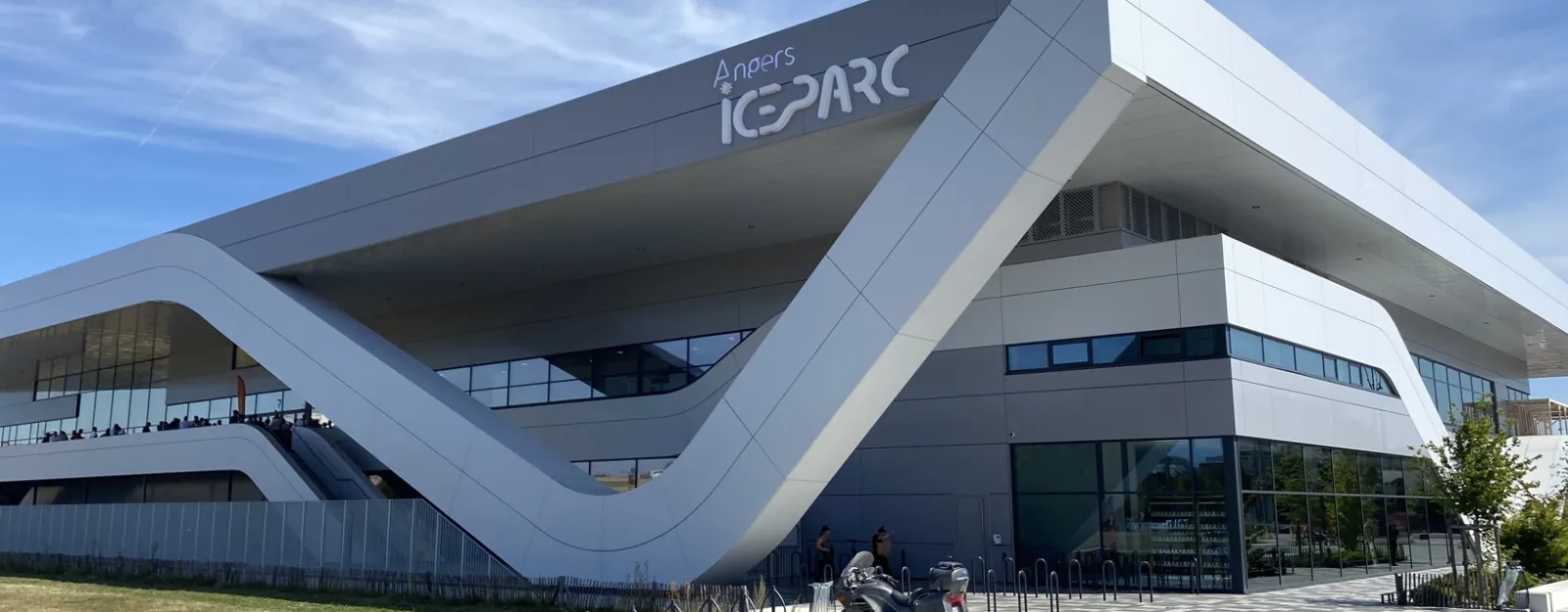 The angular white facade of Angers ICEPARC under a blue sky, with the ICEPARC sign on the upper wall. — Angers ICEPARC