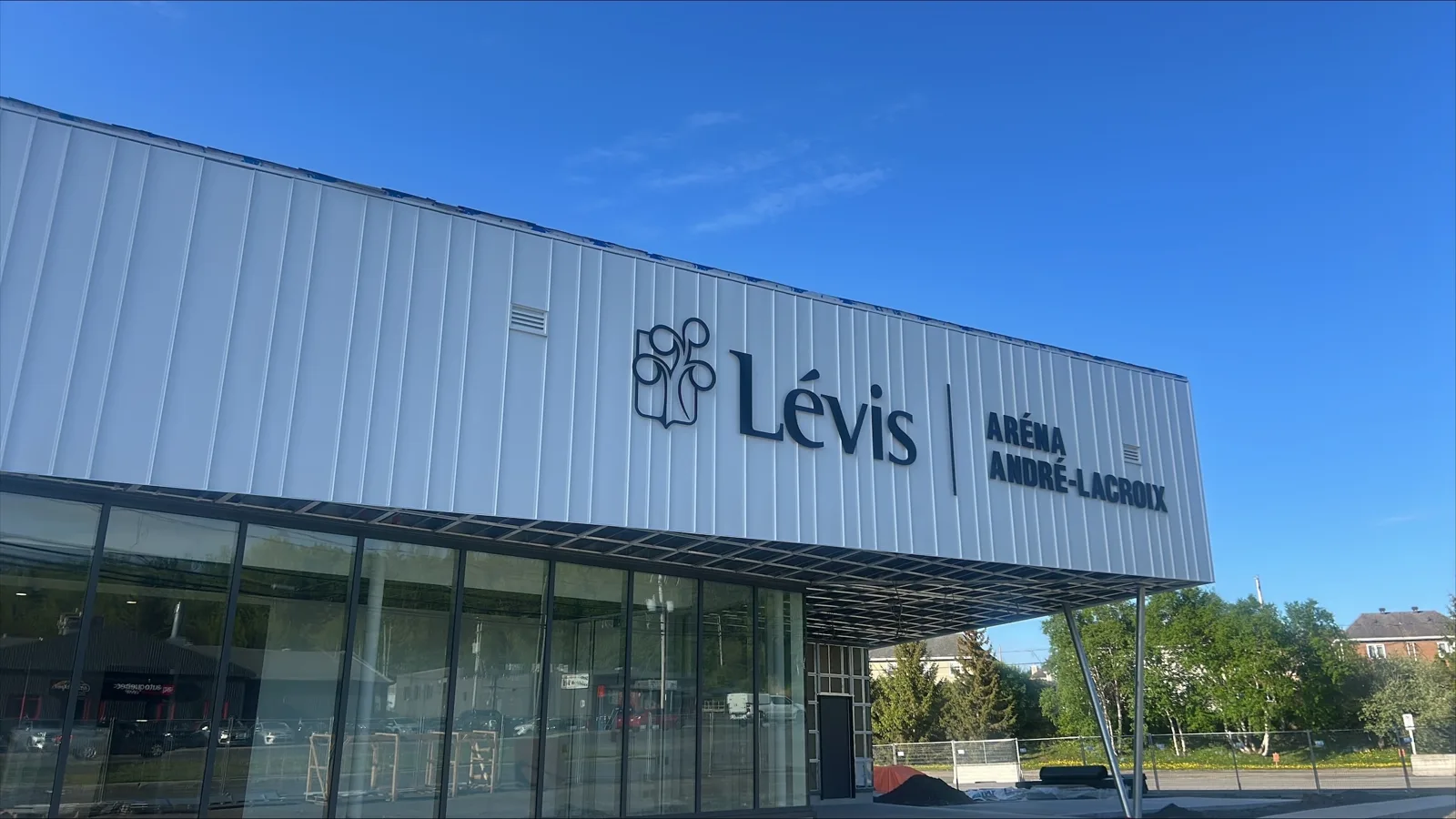 The glass-fronted entrance of the Aréna André-Lacroix in Lévis, under its Lévis sign. — Aréna André-Lacroix (Lévis)