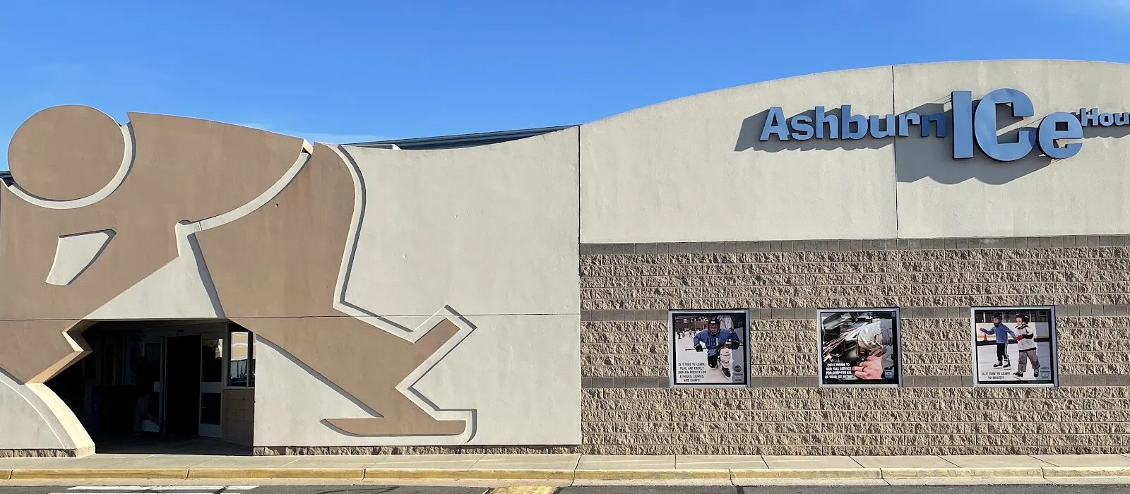 The Ashburn Ice House front: a giant skater outline framing the entrance, and the lettered name on the curved wall above the block facade — Ashburn Ice House