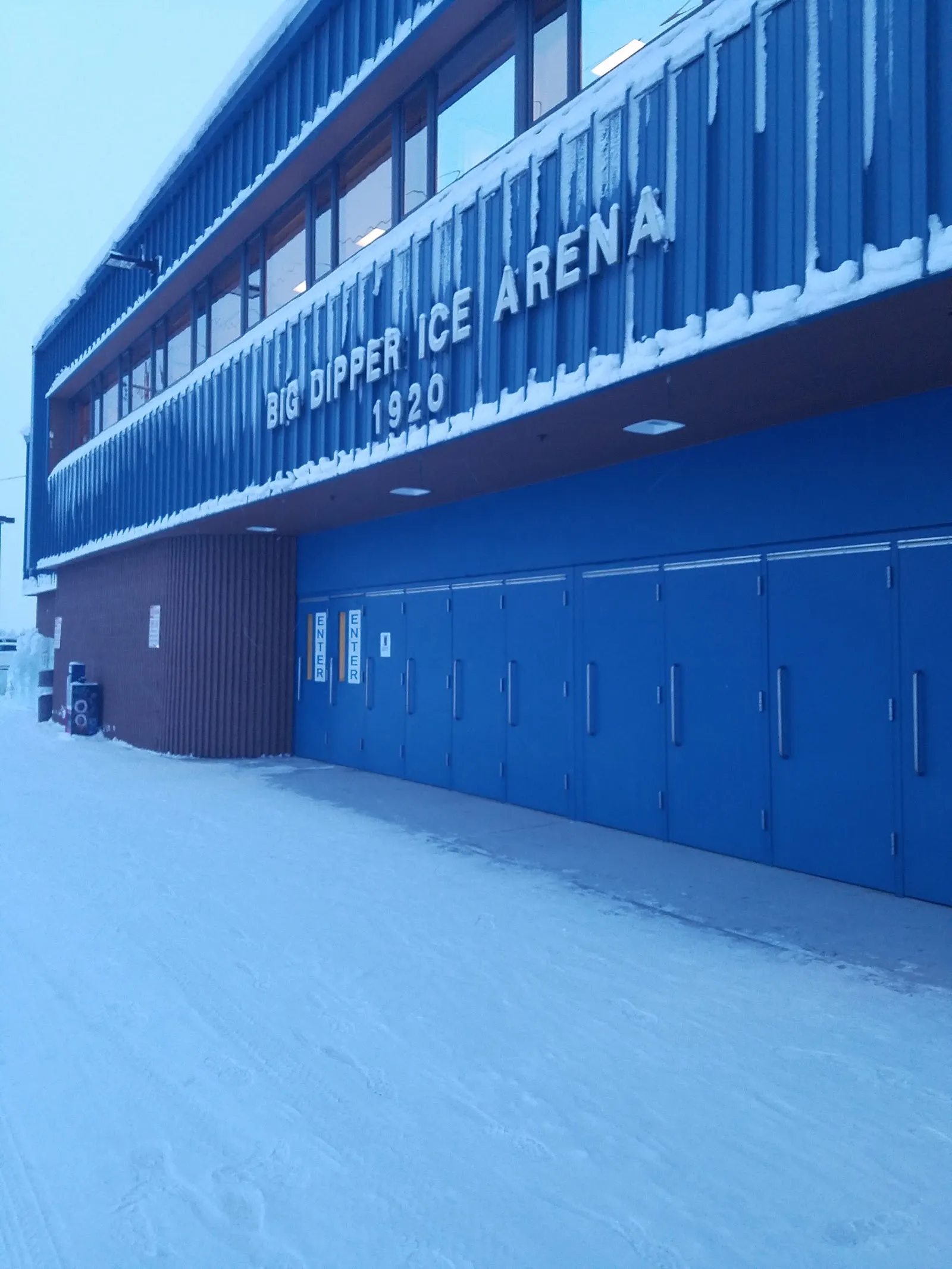 The blue Big Dipper Ice Arena building with its sign, in winter. — Big Dipper Ice Arena