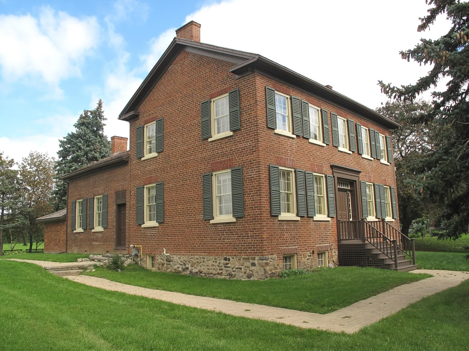 Historic Bovaird House on Bovaird Drive East, the brick farmhouse beside which the City lists its outdoor skating rink — Bovaird House Outdoor Skating Rink