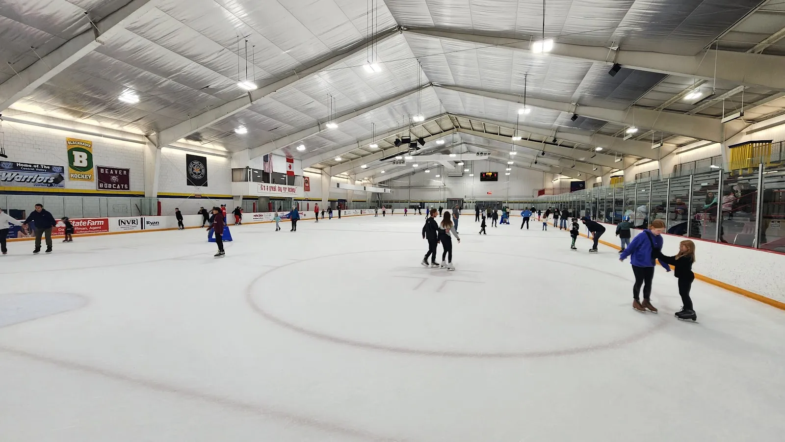 Open skating on the ice at Brady's Run Ice Arena, skaters at a distance — Bradys Run Park Ice Arena