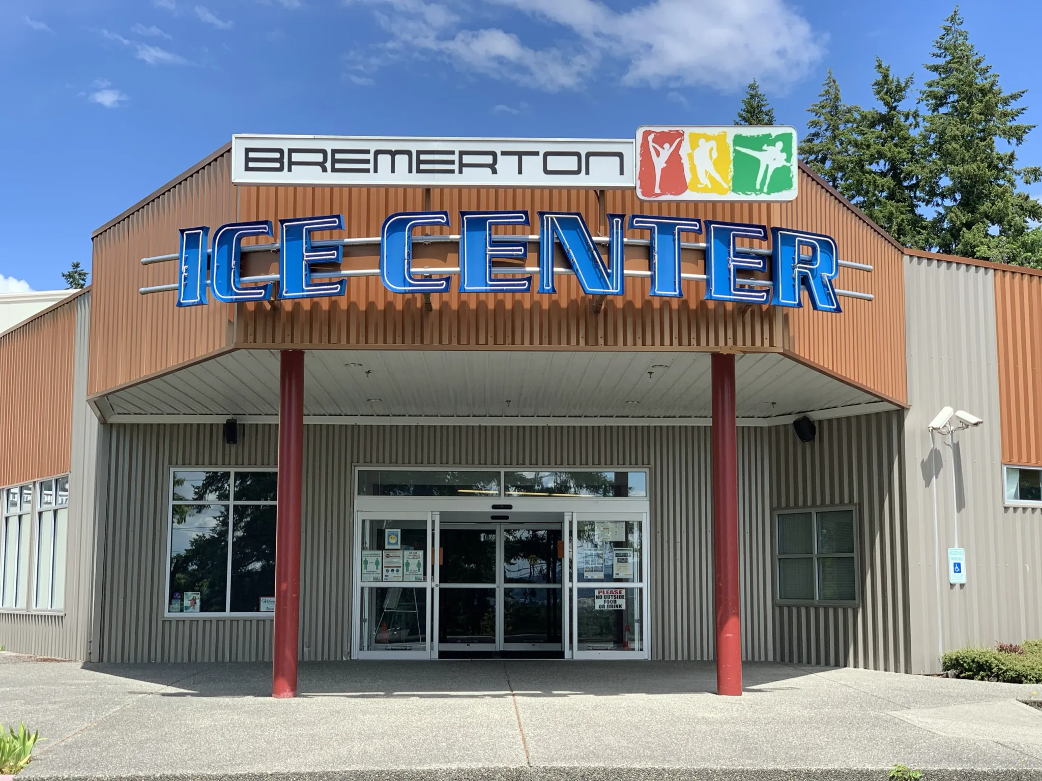 Main entrance shot square-on in bright sun — Bremerton Ice Center