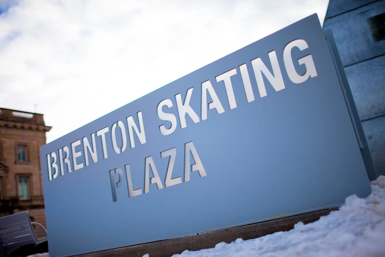 The Brenton Skating Plaza sign beside the rink in winter (Google Maps listing photo) — Brenton Skating Plaza