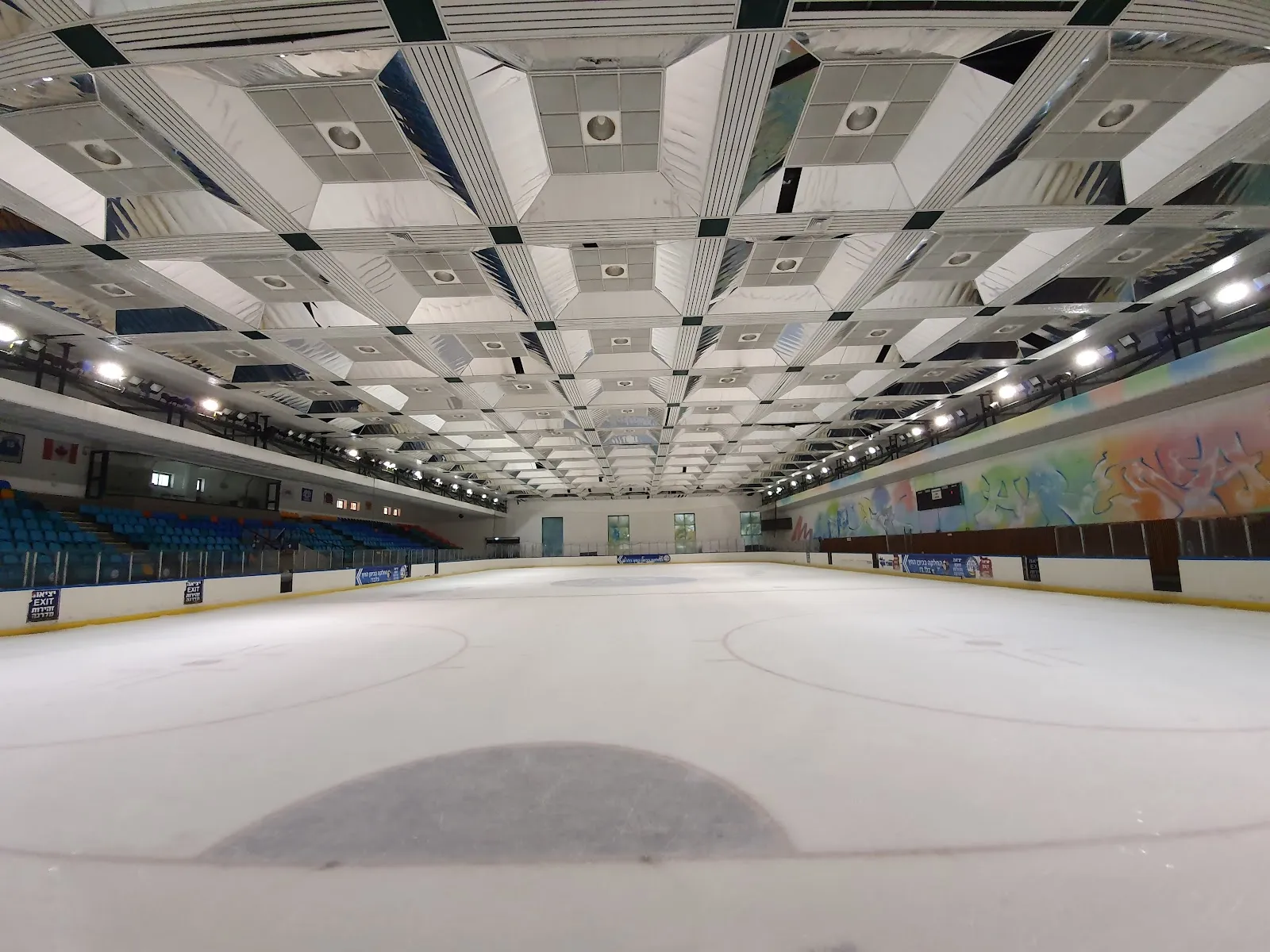The Olympic-size ice sheet of the Canada Centre under its vaulted roof, empty of skaters — Canada Centre