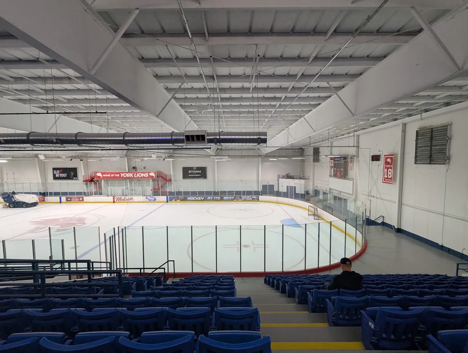 The main NFP Athletic Centre rink from the top of the blue stands, with a "Home of the York Lions" banner on the far wall. — NFP Athletic Centre - York