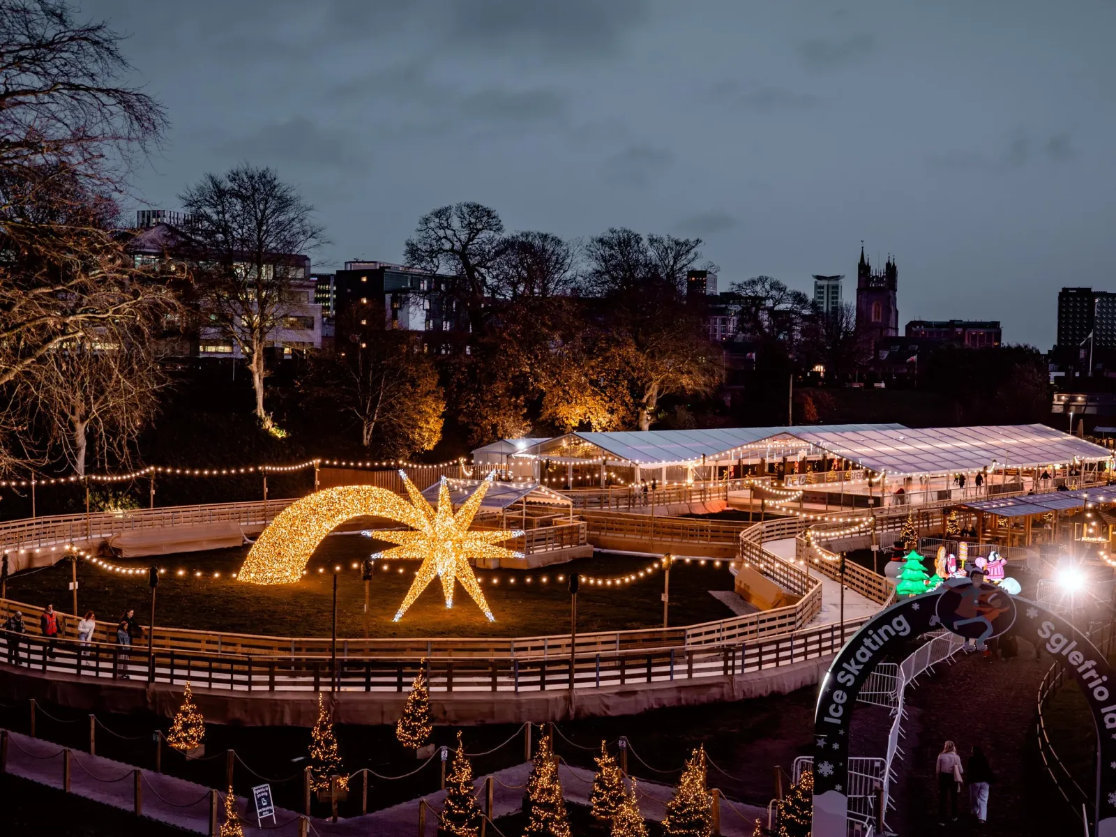 The ice trail and covered rink in the grounds of Cardiff Castle at dusk — Cardiff Castle Ice Rink (Cardiff's Winter Wonderland)