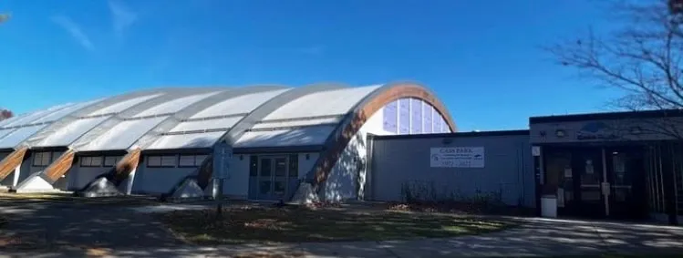 Cass Park Rink exterior with its arched roof, Ithaca — Cass Park Rink