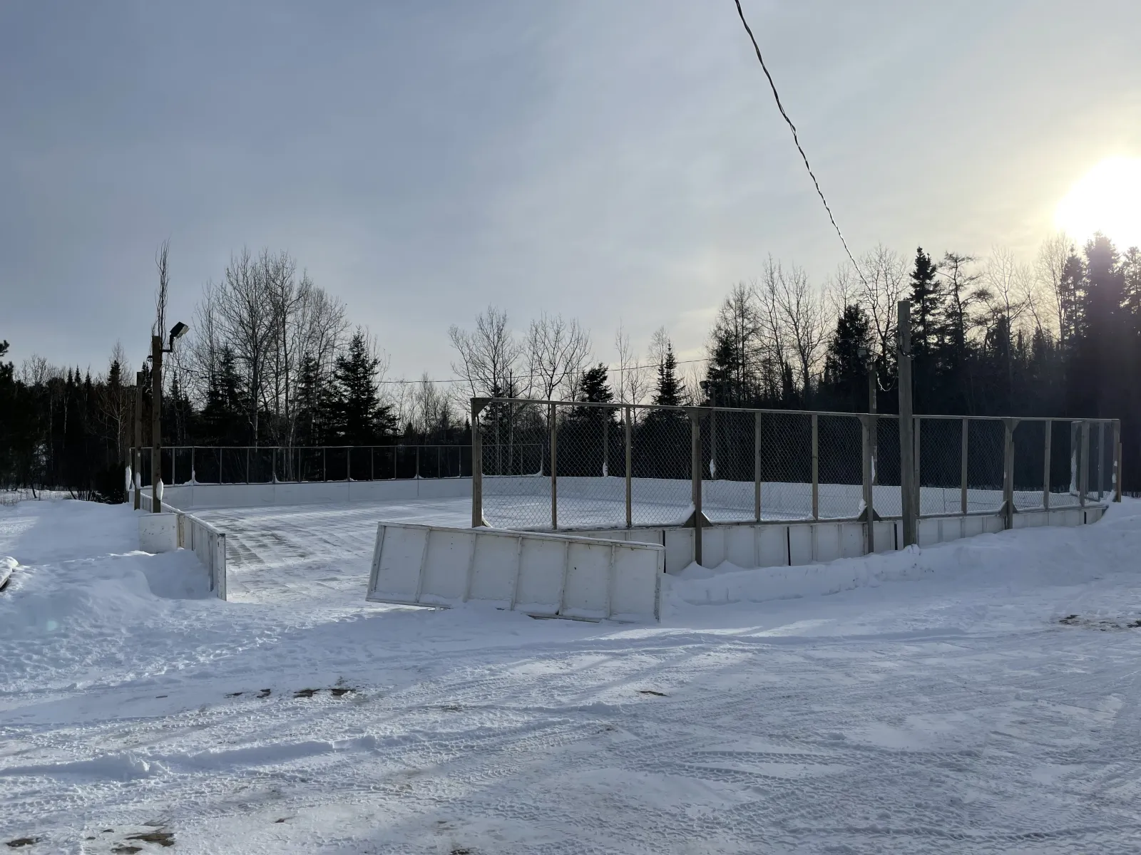 The boarded rink at Castlegreen Fieldhouse under a winter sun — Castlegreen Fieldhouse Outdoor Rink