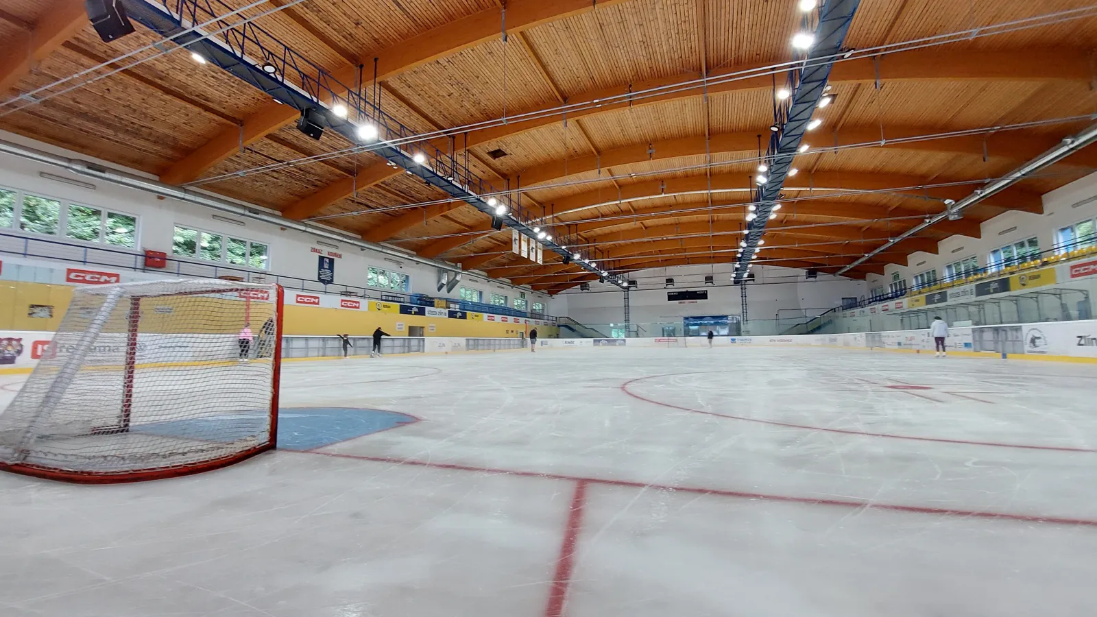 The empty ice of the CCM Aréna with the goal and the timber roof — CCM Aréna Zlín