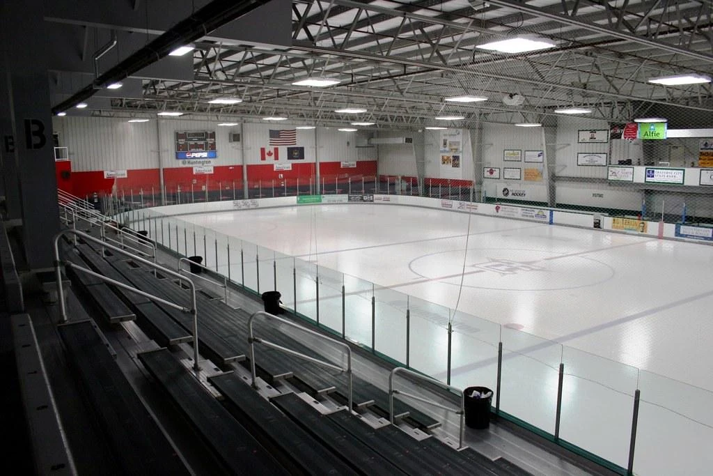 A wide view of Centre Ice Arena’s Huntington Rink from the top of the bleachers, empty and freshly resurfaced. — Centre Ice Arena