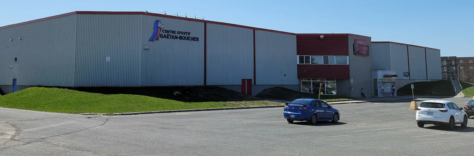 The Centre sportif Gaétan-Boucher in Saint-Hubert, with its sign on the arena wall. — Centre sportif Gaétan-Boucher