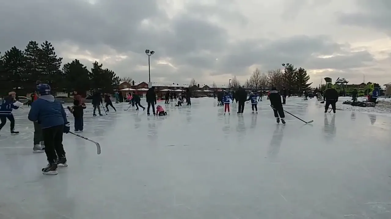 Skaters and hockey players on the outdoor ice at Chancellor Park Rink — Chancellor Community Centre Outdoor Rink (Vaughan)