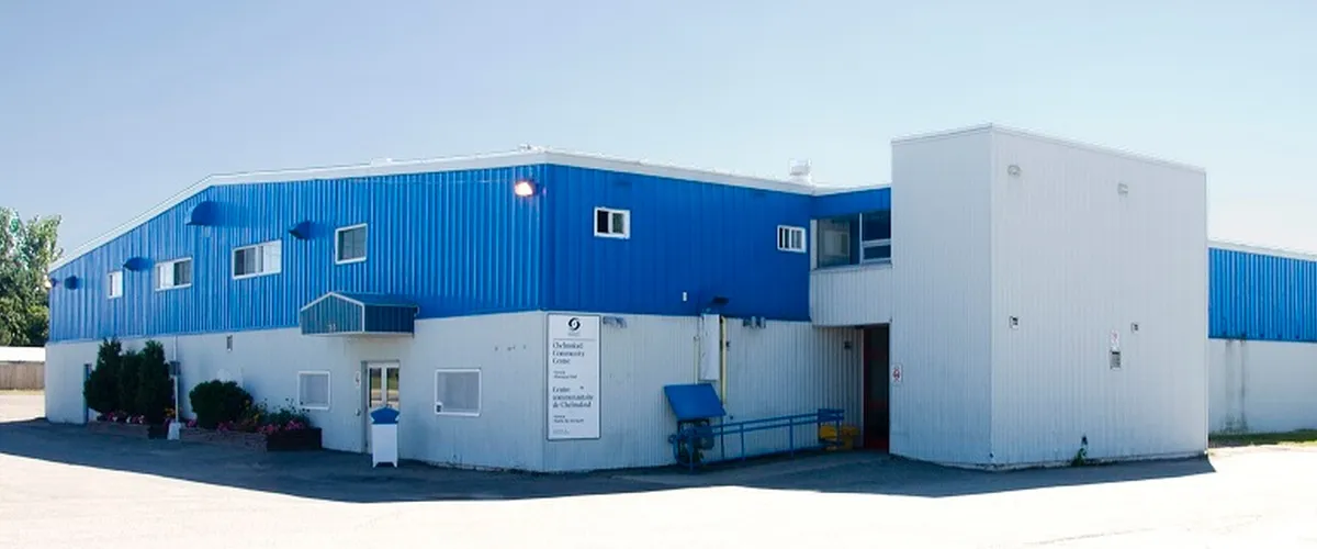 The two-storey blue and white metal-clad arena with its front entrance. — Chelmsford Community Centre and Arena