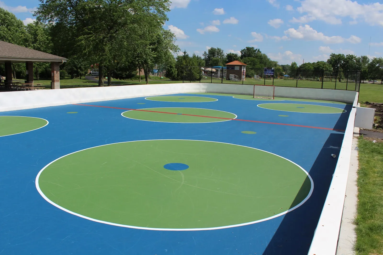 The Circle Park rink surface in Bloomingdale, shown in summer; it is flooded for skating in winter — Circle Park Ice Rink