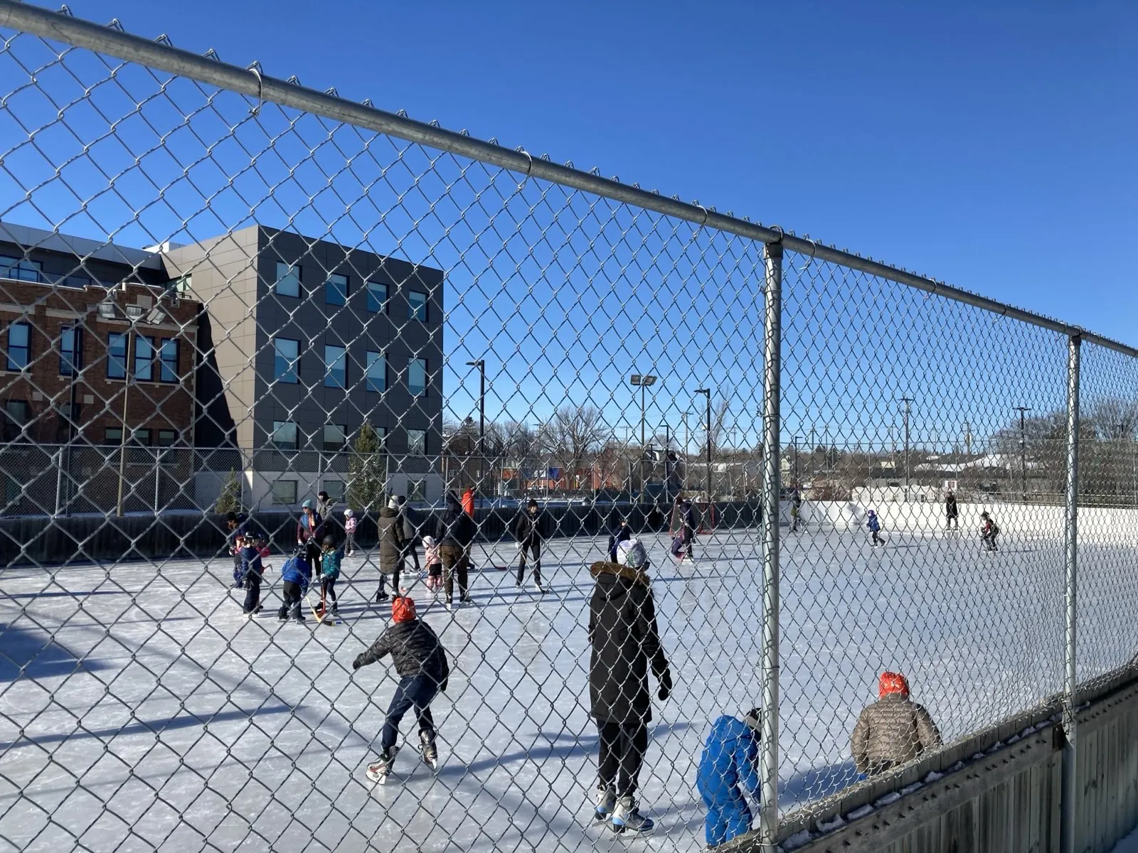 Skaters on the City Park community rink (City Park Community Association, Rink Day 2024) — City Park Outdoor Rink (Saskatoon)