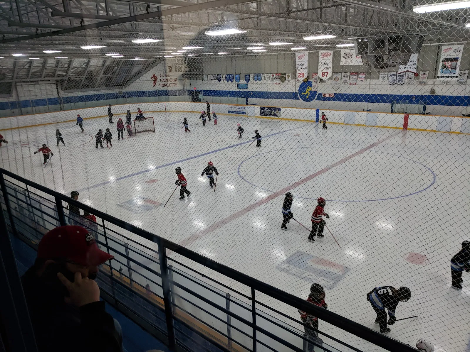 Cole Harbour Place arena: youngsters skating on the ice from the upper walkway — Cole Harbour Place