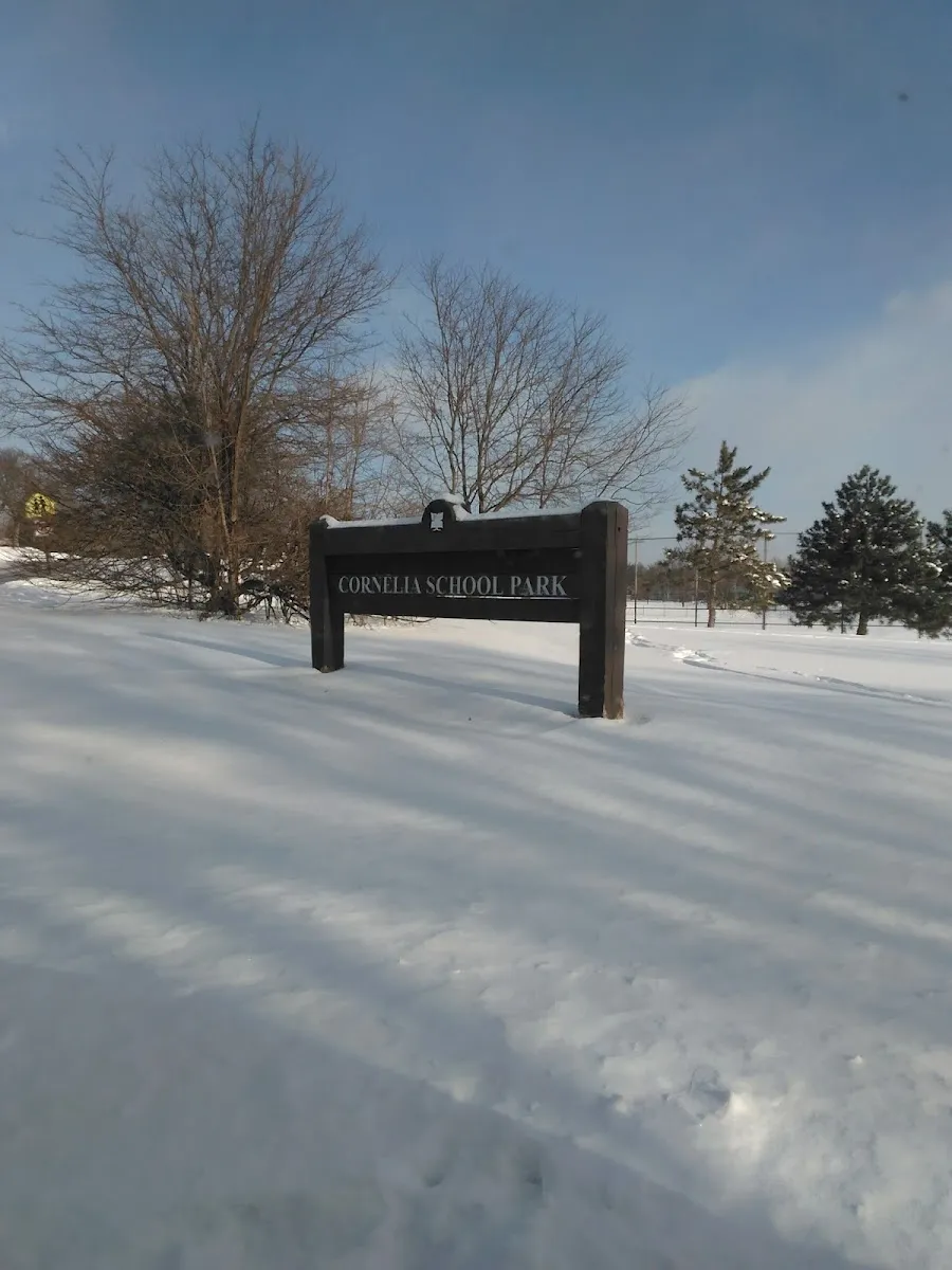 The Cornelia School Park sign in snow beside the rinks — Cornelia School Park Ice Rinks