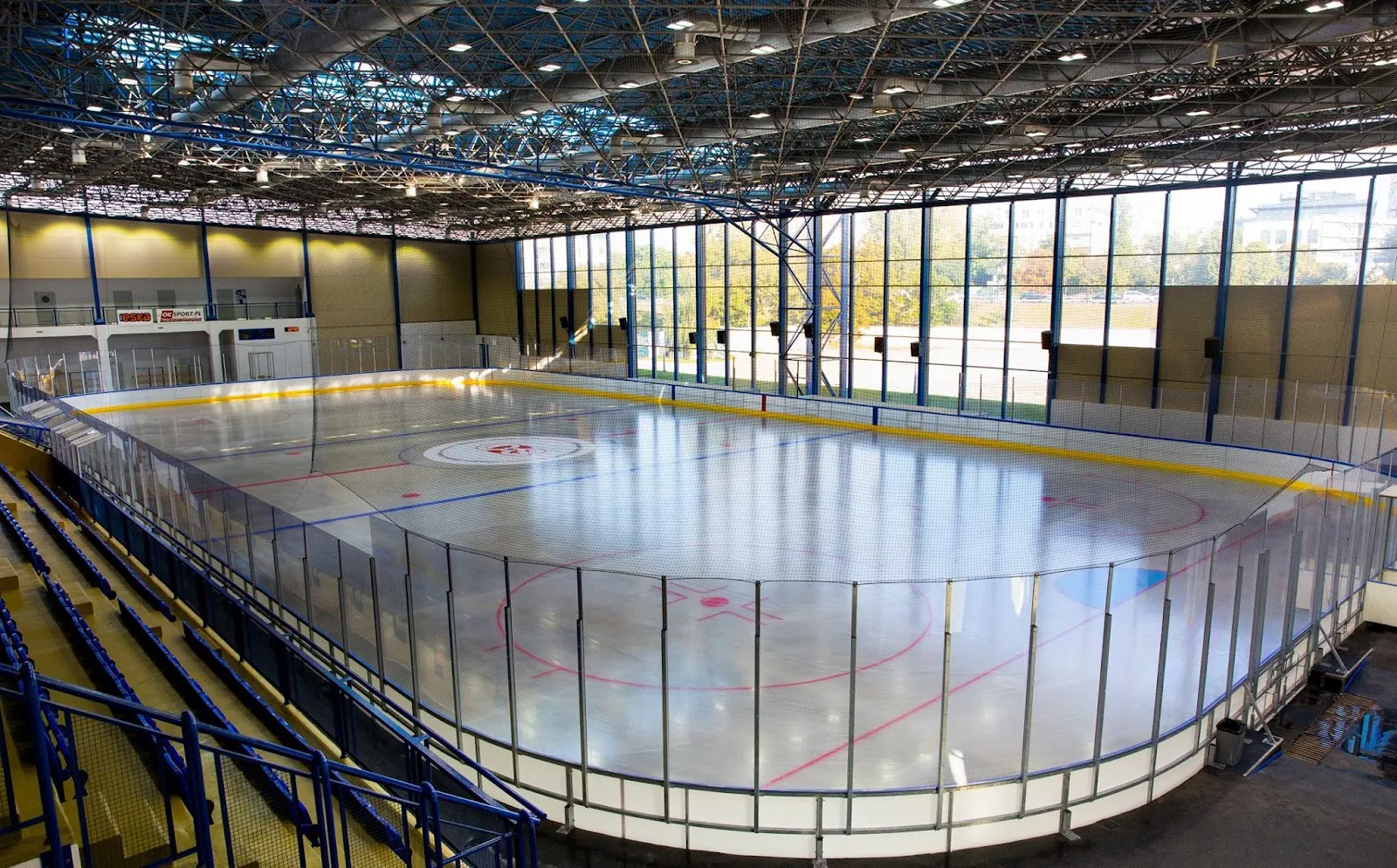 The empty ice sheet and stands of the Torwar II ice rink — COS Torwar Lodowisko (Torwar II)