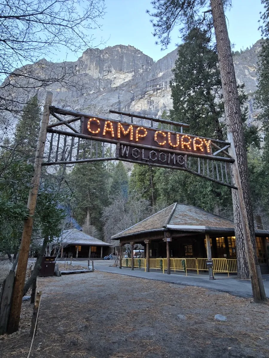 The Camp Curry entrance sign and lodge buildings at Curry Village, Yosemite — Curry Village Ice Rink