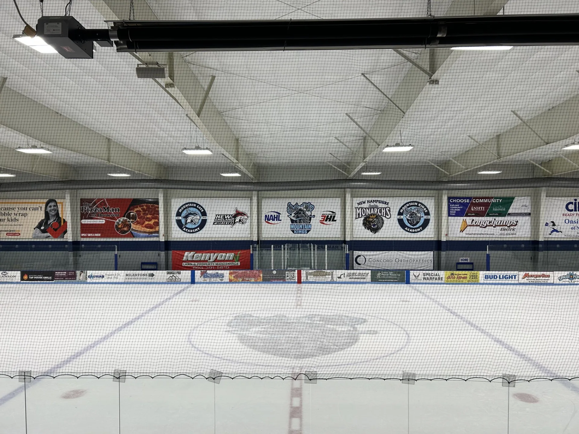 Looking across the main rink at Delta Dental Arena through the end netting — Delta Dental Arena