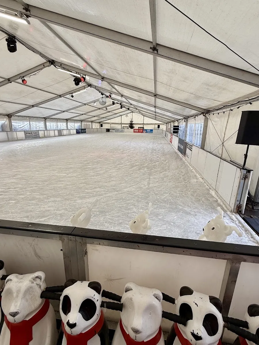 The empty ice sheet inside the Eisbahn Sellin tent in the Seepark – Eisbahn Sellin im Seepark