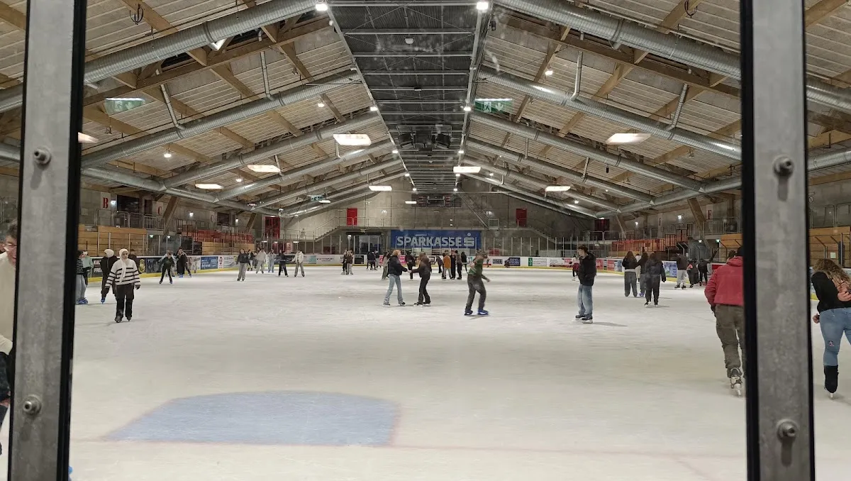 Interior of the Eishalle Amstetten with skaters on the ice — Eishalle Amstetten