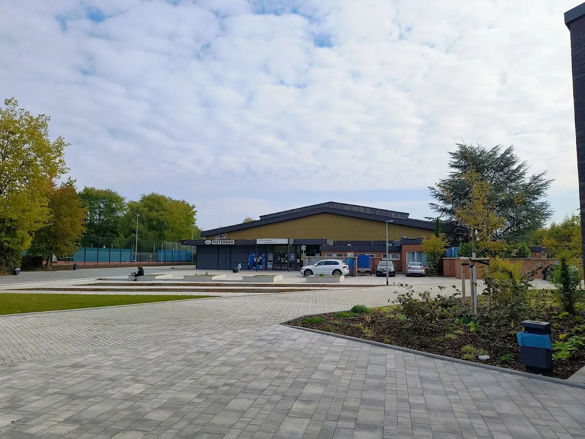 The Eishalle Bergkamen at the edge of its paved forecourt. — Eishalle Bergkamen