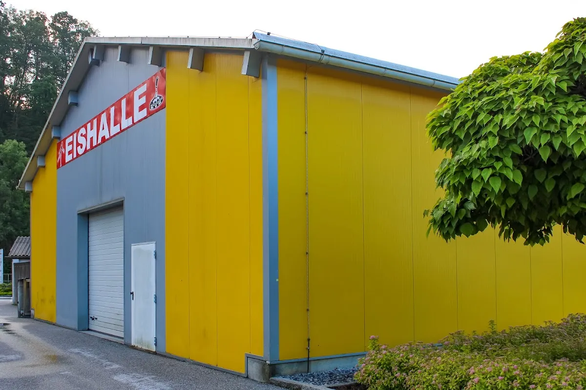 The Eishalle Rosental seen from the street with its EISHALLE lettering — Eishalle Rosental an der Kainach