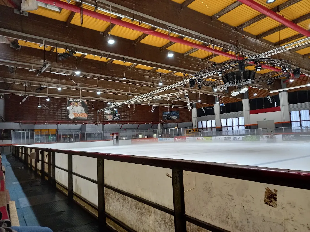 The empty ice surface of the Eissporthalle Dinslaken seen from the rink side. — Eissporthalle Dinslaken