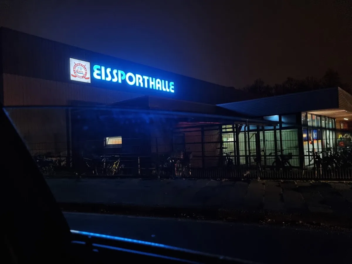 The Eissporthalle Rheine with its lit sign at night. — Eissporthalle Rheine
