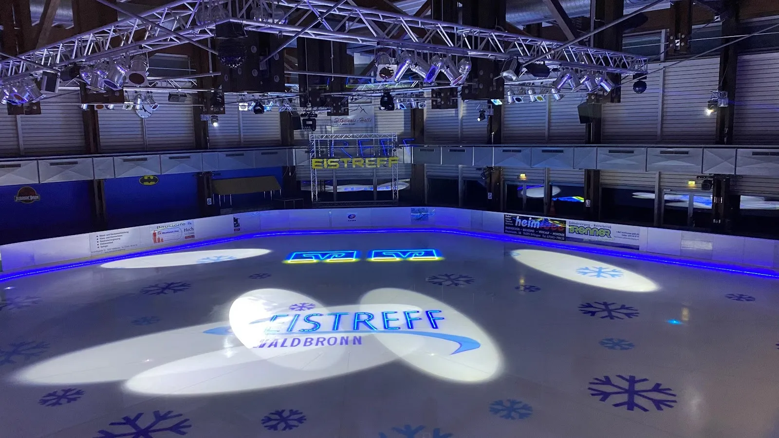 The ice surface of the Eistreff Waldbronn lit for an Eisparty — Eistreff Waldbronn