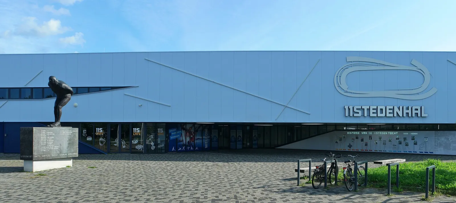 The Elfstedenhal in Leeuwarden with the Elfstedenrijder statue — Elfstedenhal