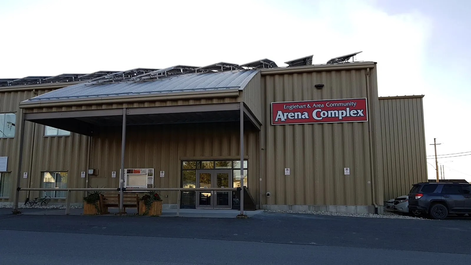 The corrugated-steel front of the Englehart Arena with its sign above the entrance. — Englehart and Area Community Arena Complex