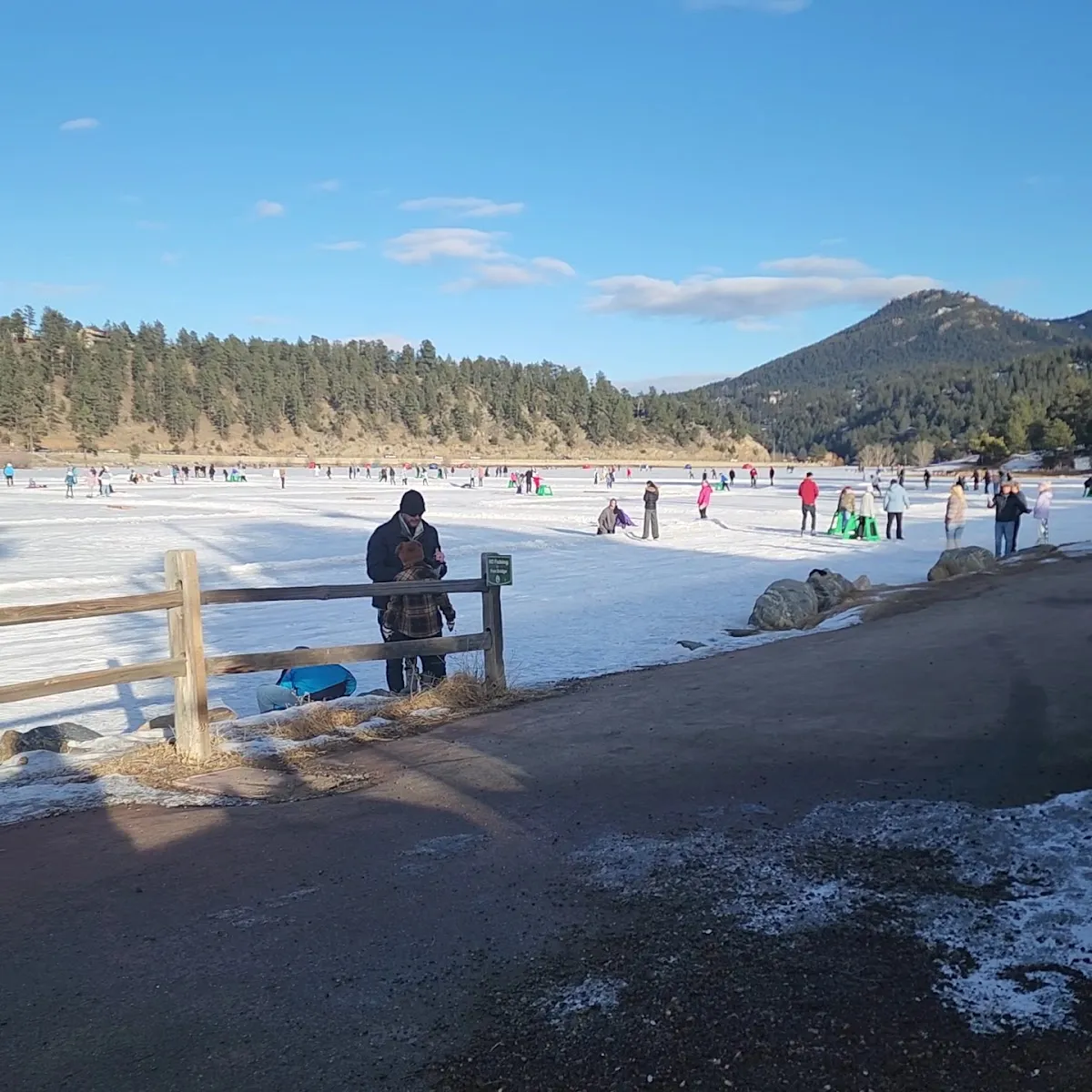 Skaters on the frozen Evergreen Lake rinks on a sunny winter day (Google Maps listing photo) — Evergreen Lake Ice Rinks
