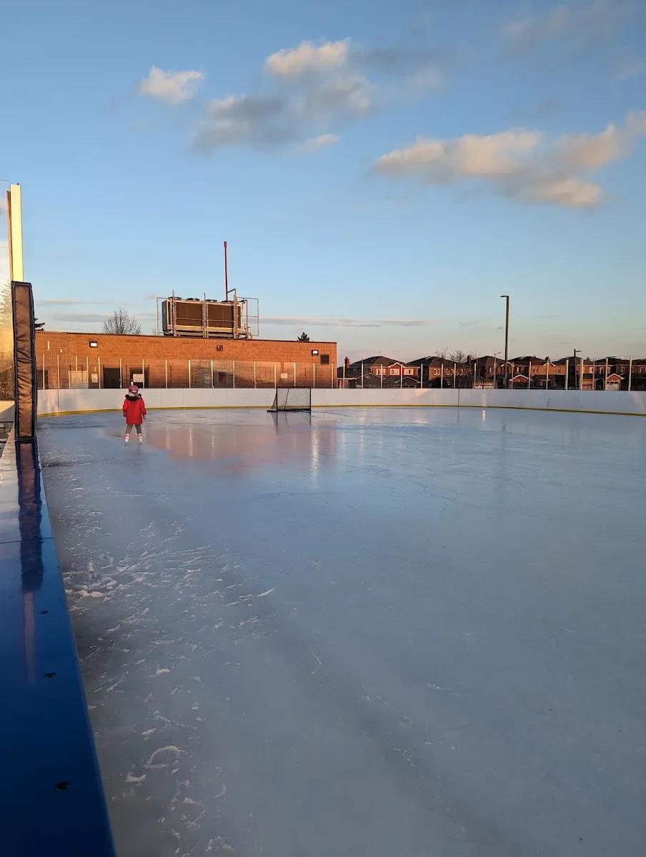 A skater on the Father Bulfon outdoor rink at sunset — Father E. Bulfon Community Centre Outdoor Rink (Vaughan)