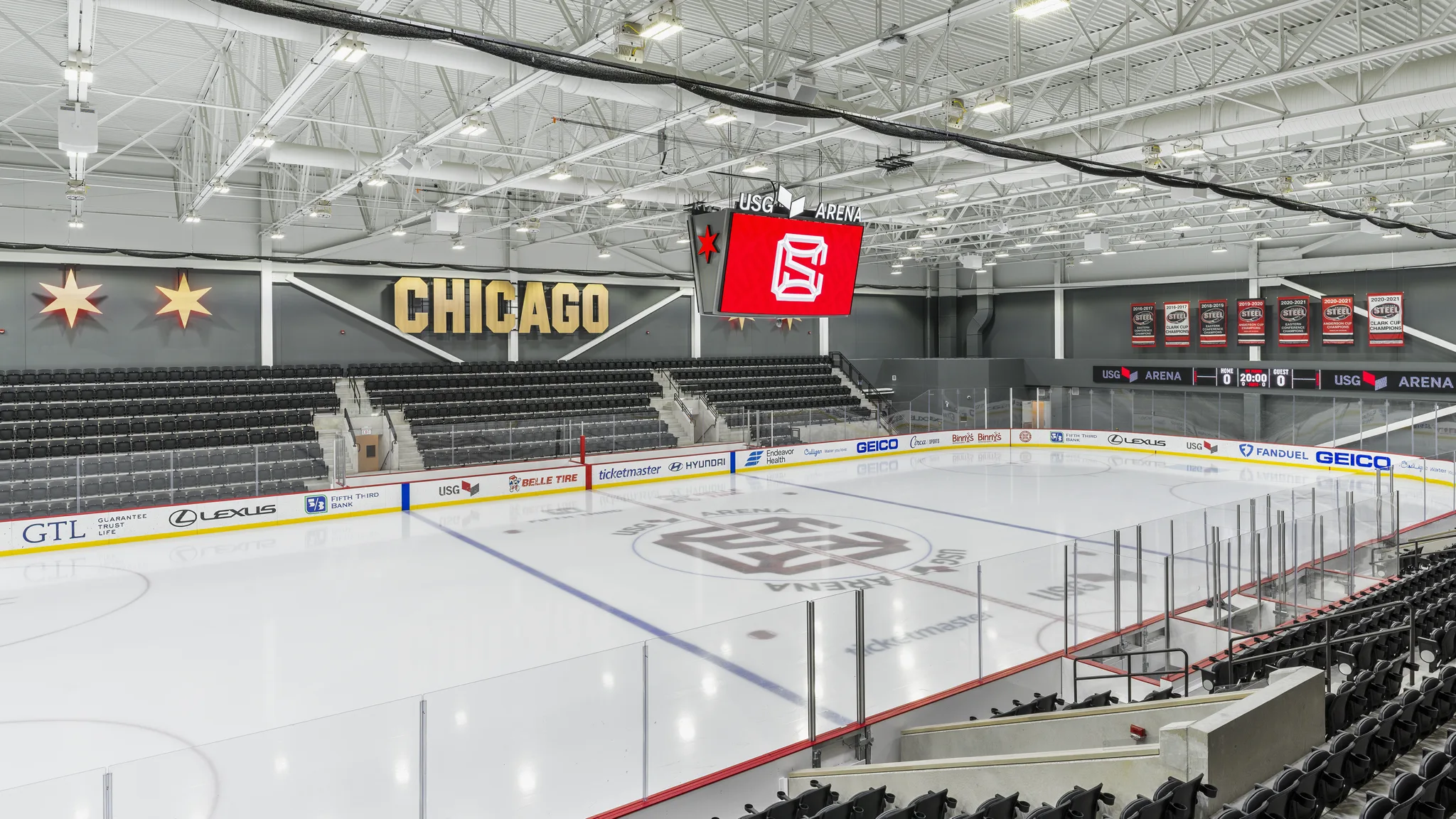 The empty main sheet from the upper corner seats, with CHICAGO lettering and the USG Arena scoreboard — Fifth Third Arena (Blackhawks Ice Center)