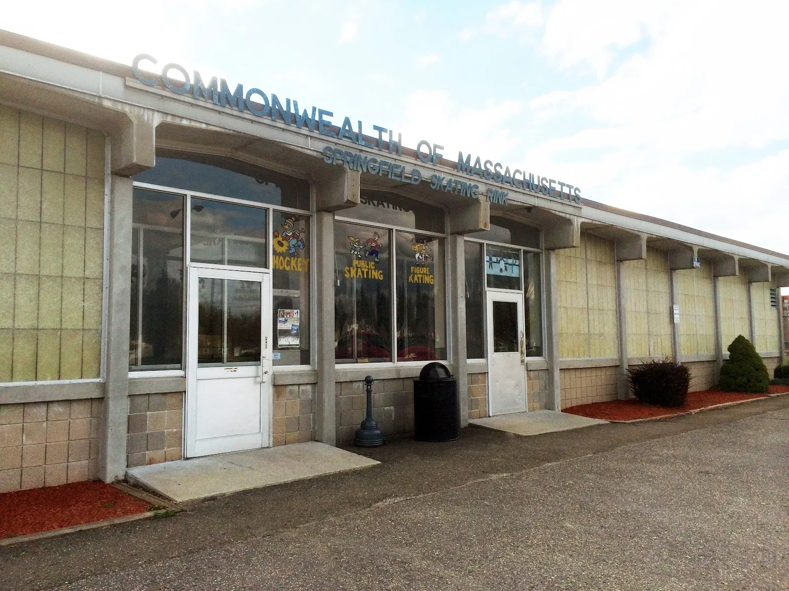 The Springfield Skating Rink front under Commonwealth of Massachusetts lettering, hockey and skating painted in the windows — Smead Arena