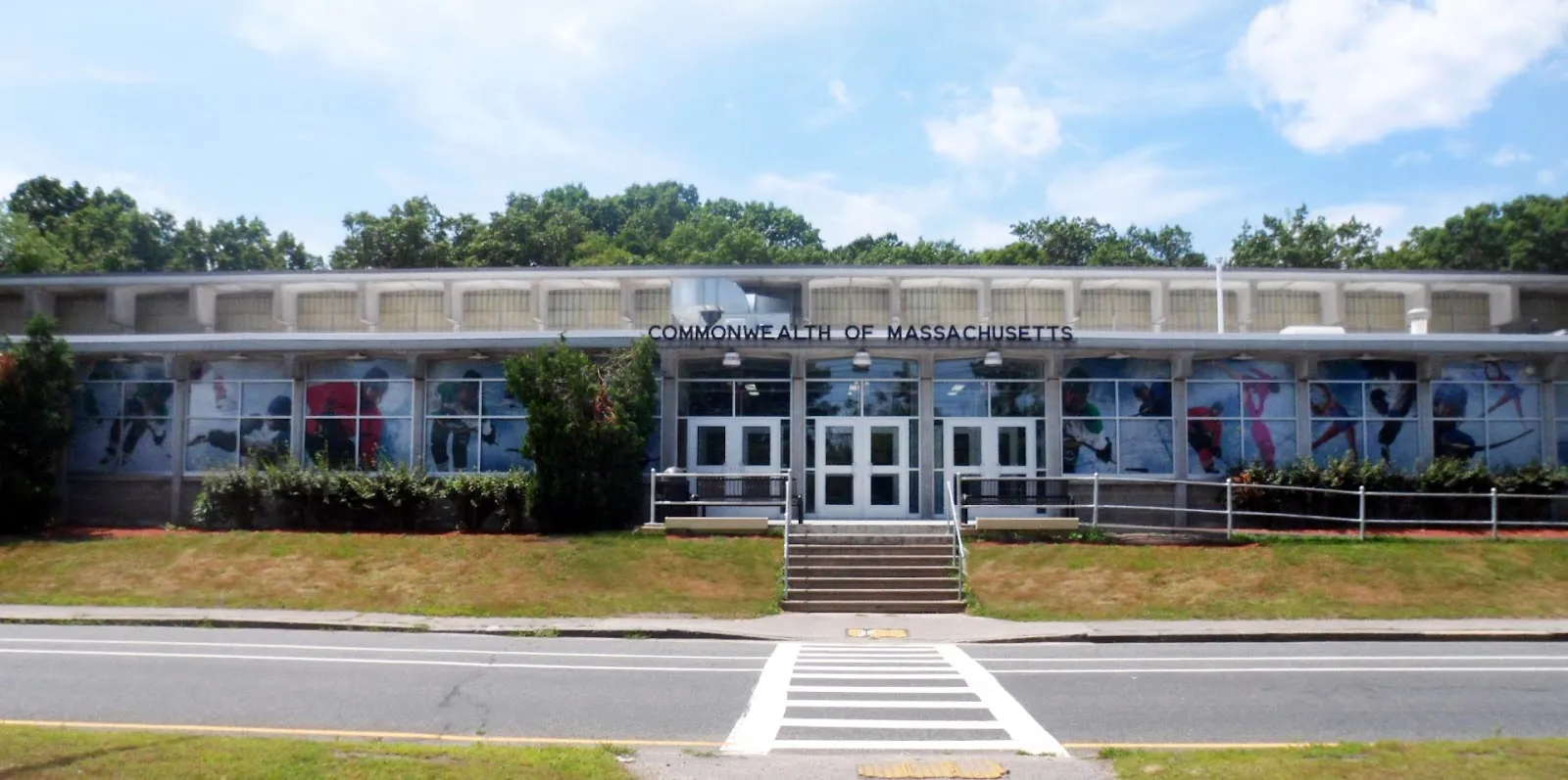 The Buffone Arena front on Lake Avenue, a long low state rink with skater graphics in its windows and steps up to the doors — Buffone Skating Arena