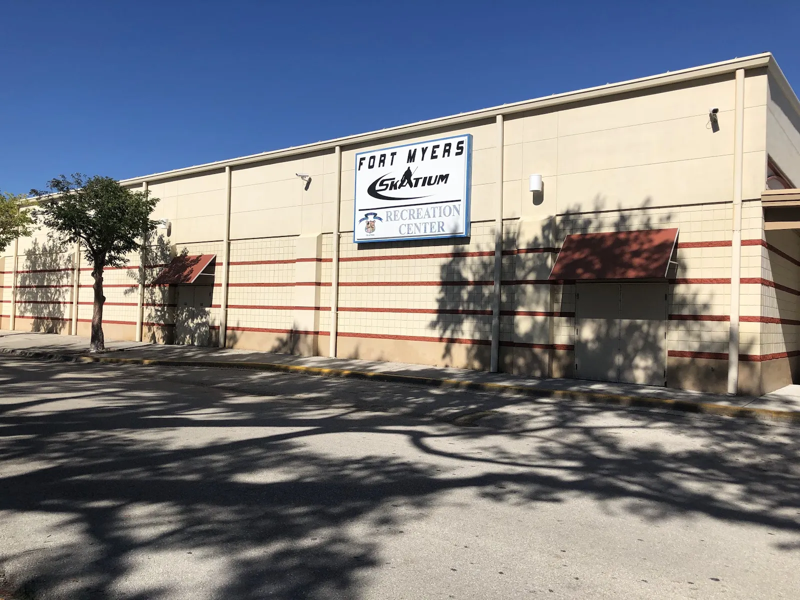 Front of the Fort Myers Skatium Recreation Center on Broadway with its sign — Fort Myers Skatium