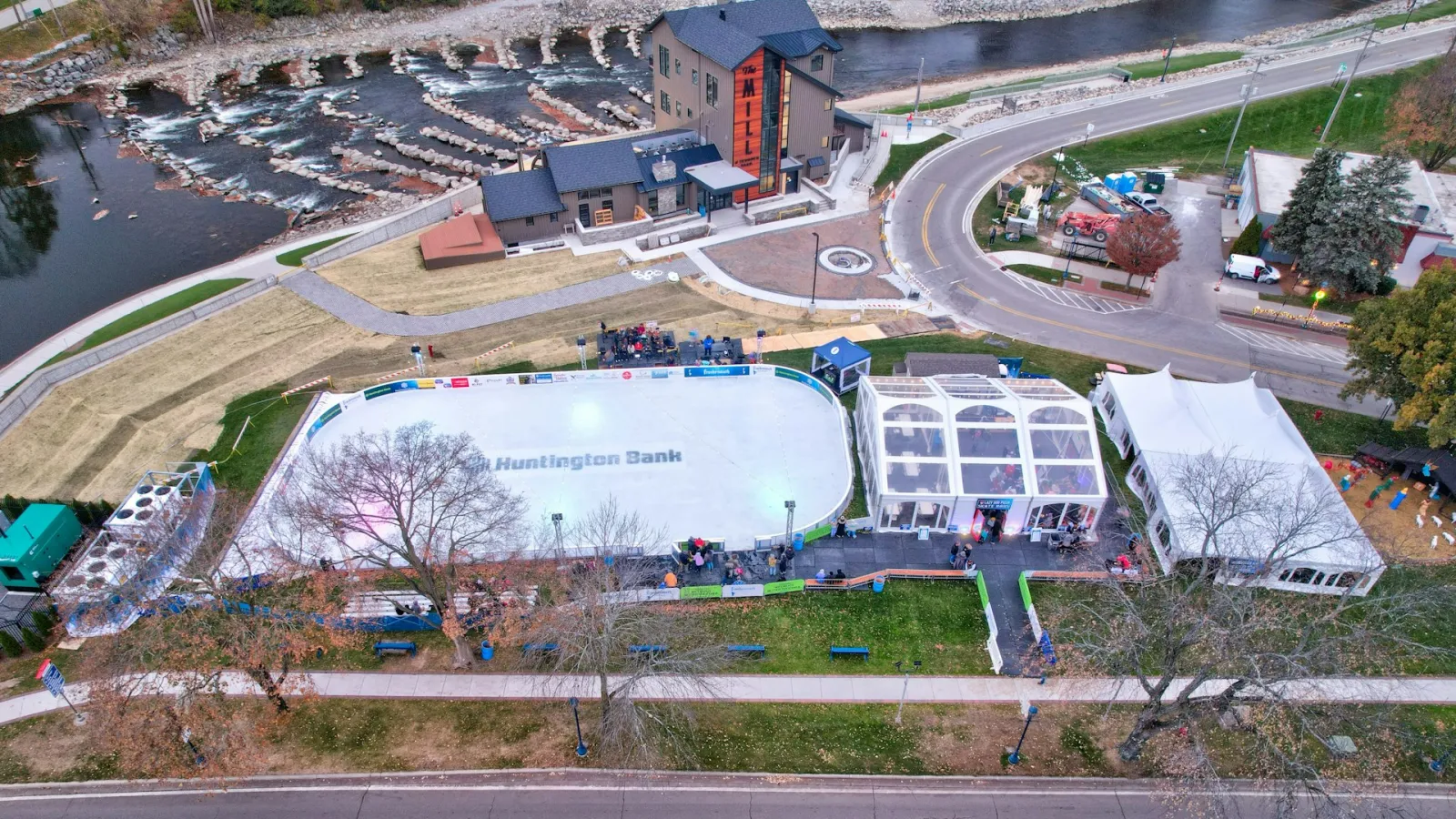 Aerial view of the Frankenmuth Ice Rink and its tents in Zehnder Park at twilight (Frankenmuth Convention & Visitors Bureau) — Frankenmuth Ice Rink