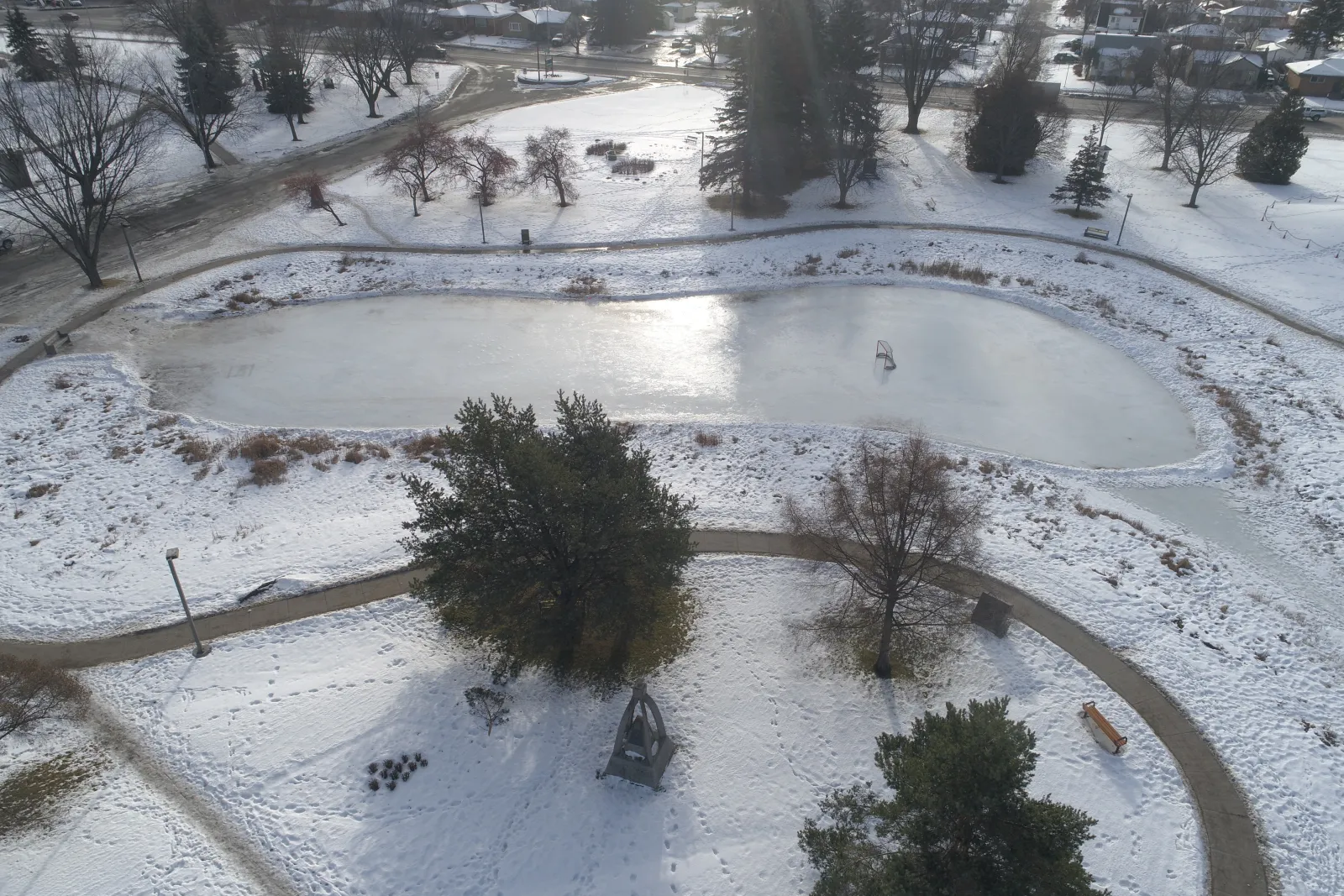 The Friendship Gardens skating pond seen from above, with the walking path around it — Friendship Gardens Skating Pond