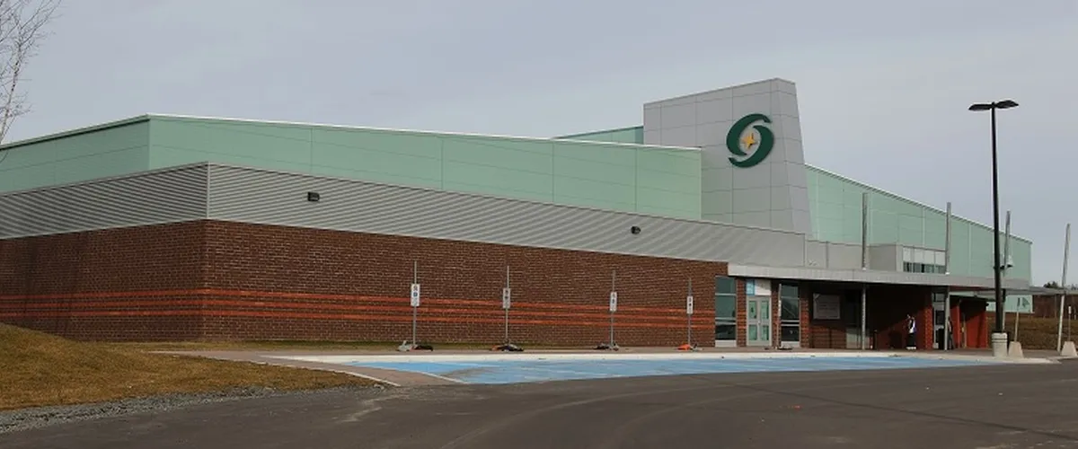 The brick and green-clad twin-pad complex with the City logo tower over its entrance. — Gerry McCrory Countryside Sports Complex