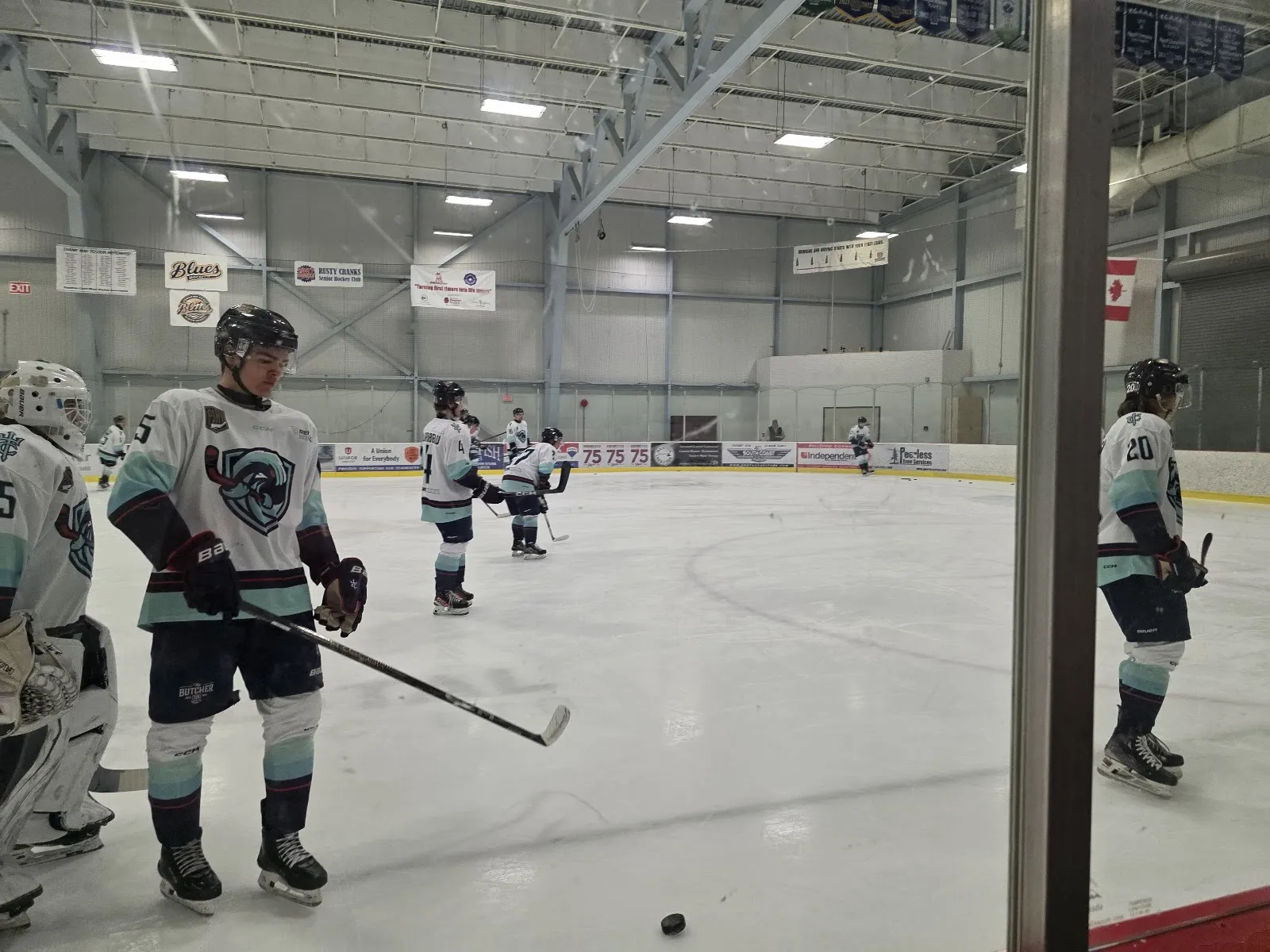 Players on the bench side of the ice at the Gibsons and Area Community Centre arena during a game. — Gibsons and Area Community Centre
